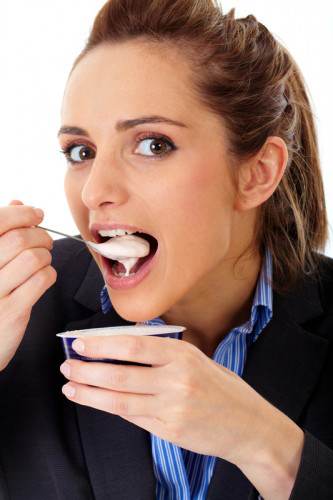 woman eating yogurt