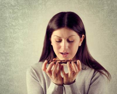 girl sitting eating chocolate