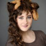 https://www.dreamstime.com/stock-photography-girl-bread-rolls-biscuits-bagels-hair-image30350522