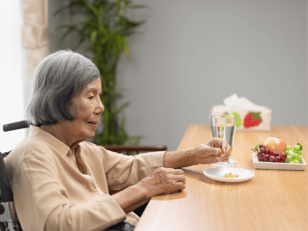 An Old Woman Taking Fish Oil Supplement 