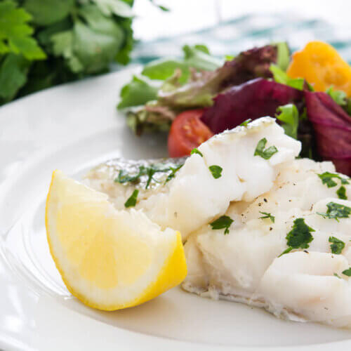 Cod fillet with olive oil, lemon and herbs